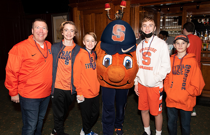 Family with children posing with Otto.